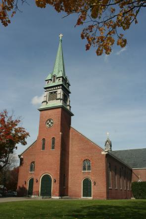 The completed painting restoration displays a historically appropriate multi-colored theme that compliments the brick exterior.