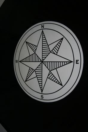 Detail of compass rose painted floor decoration